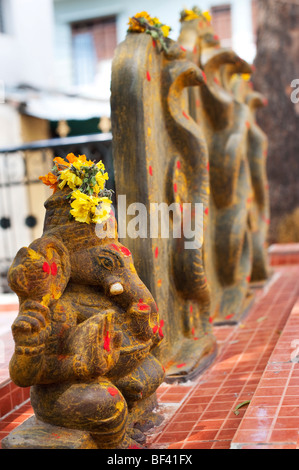 Ganesha statue on an altar in the village of Puttaparthi, Southern India Stock Photo