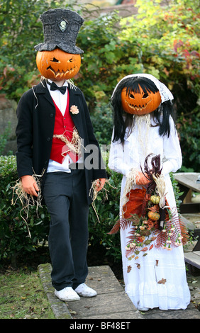 Boy and girl dressed with pumpkin heads at the Halloween competition in Burley in the New Forrest Hampshire United Kingdom Stock Photo