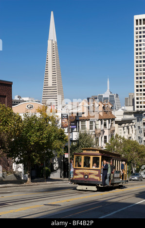 Cable Car in California Street, corner of Powell Street, with Transamerica Pyramid in the back, San Francisco, California, USA Stock Photo