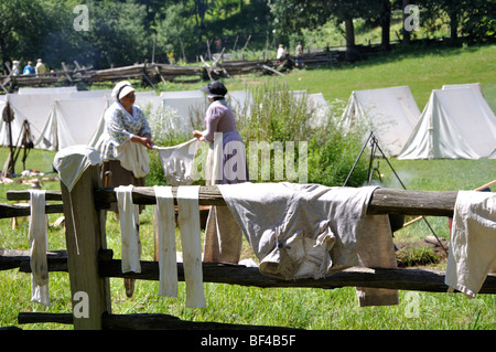 Women washing clothes - costumed American Revolutionary War (1770's) era re-enactment Stock Photo