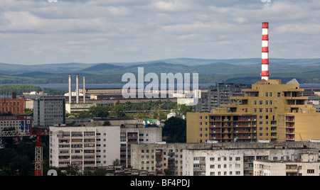 Cityscape with apartment blocks industrial buildings and Islet river, Ekaterinburg, Urals, Russia Stock Photo