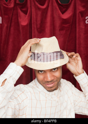 African man in hat acting cool Stock Photo