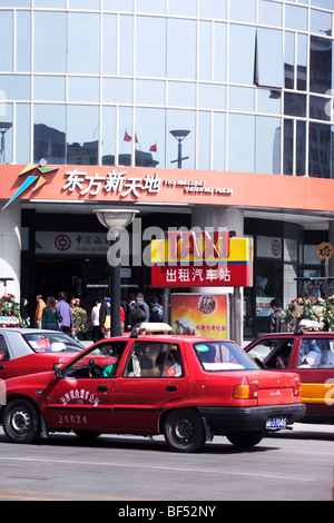 Taxi stop in front of Oriental Plaza, Wangfujing, Beijing, China Stock Photo