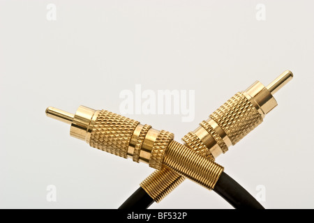 Gold connectors attached to wires Stock Photo