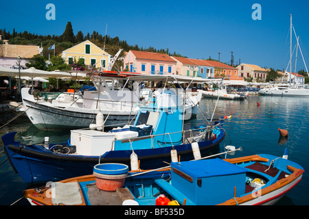 Fiskardo port Kefalonia island Greece - survivor of the 1953 earthquake - waterfront marina with boats Stock Photo