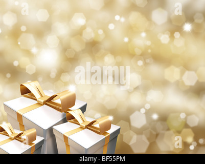 Christmas gifts on golden background of blurred lights Stock Photo