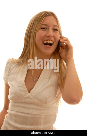 Eighteen year old woman with a mobile phone, looking puzzled Stock