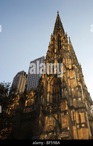 Side wide-angle street view of St. Patrick's Cathedral on Fifth Avenue, New York City, USA. Stock Photo