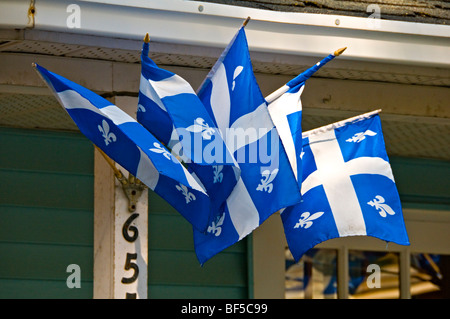 Quebec flags on a house in the Village of St Denis sur Richelieu Quebec Canada Stock Photo