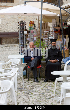 Orthodox priest and old man, Omodos in the Troodos mountains, Cyprus, Greece, Europe Stock Photo