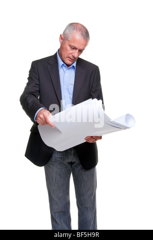 Male architect holding a set of building plans, isolated on a white background. Stock Photo