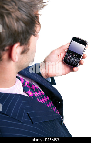 Businessman checking his phone for messages. Clipping path for screen. Stock Photo