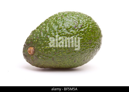 Green Avocado Pear isolated against white background. Stock Photo