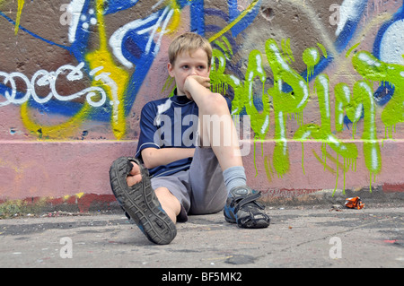 9-year-old boy, bored, football ground in Cologne, North Rhine-Westphalia, Germany, Europe Stock Photo