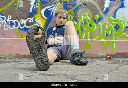 9-year-old boy, bored, football ground in Cologne, North Rhine-Westphalia, Germany, Europe Stock Photo