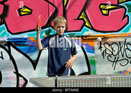 9-year-old boy playing table tennis, football ground in Cologne, North Rhine-Westphalia, Germany, Europe Stock Photo