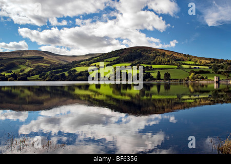 Perfect reflection at Talybont reservoir, Brecon Beacons in Wales taken on beautiful bright sunny day