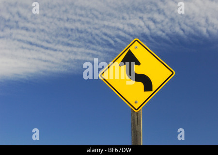 Winding road ahead sign Stock Photo