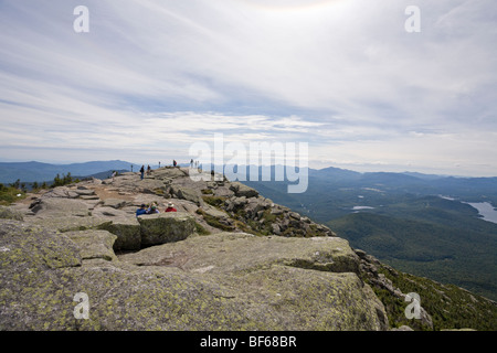 Whiteface View from the peak. Visitors to the famous mountain peak wander about and enjoy view of the Adirondack high peaks Stock Photo