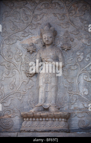 Marble screen wall carving of Buddha in Vajrasana Pagoda, Biyun Temple, Fragrant Hills, Beijing, China Stock Photo