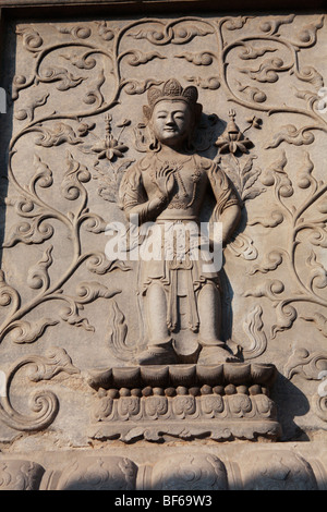 Marble screen wall carving of Buddha in Vajrasana Pagoda, Biyun Temple, Fragrant Hills, Beijing, China Stock Photo