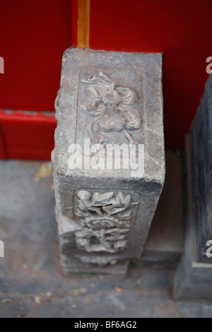 Close-up of stone carved gourd on top of a Mendun at the gate of Hutong courtyard house, Beijing, China Stock Photo