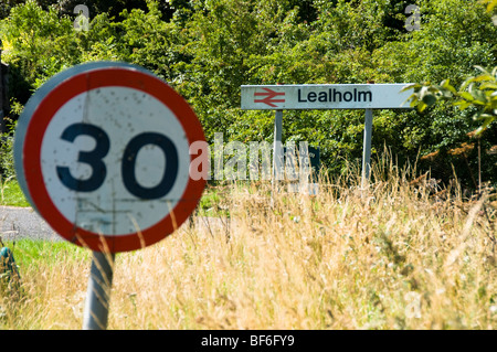 Lealholm Railway Station sign and 30 mph Speed Limit sign, Lealholm, North Yorkshire, UK Stock Photo