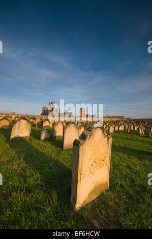 Graveyard of St Mary's Church with Whitby Abbey in the background, Whitby, North Yorkshire, UK Stock Photo