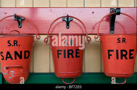 Three Southern Rail fire buckets Stock Photo