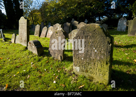 Old gravestones in the graveyard of St Nicholas church in Worth, Crawley, West Sussex, UK Stock Photo