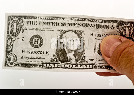 Hand holding a representation of a US dollar bill Stock Photo