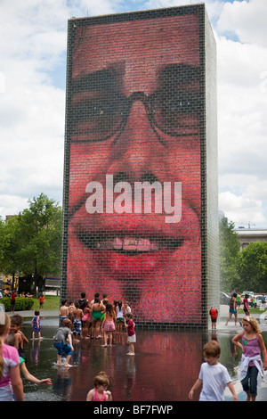 children play in the Crown Fountain, Millenium Park, Chicago, Illinois, United States of America Stock Photo