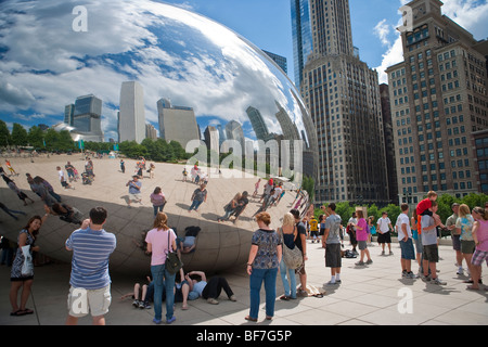 visitors reflect in the Cloud Gate installation,  AT&T Plaza, Millennium Park, Chicago, Illinois, United States of America Stock Photo