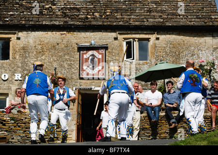 Morris Dancers outside the Victoria Inn, Eastleach, Gloucestershire, UK Stock Photo