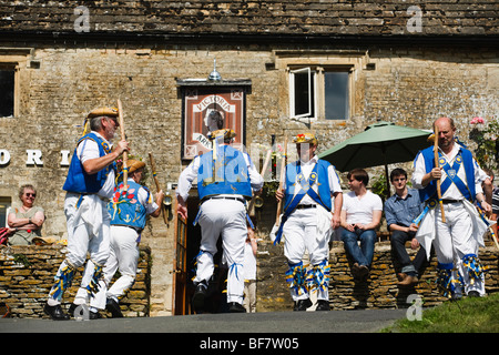 Morris Dancers outside the Victoria Inn, Eastleach, Gloucestershire, UK Stock Photo