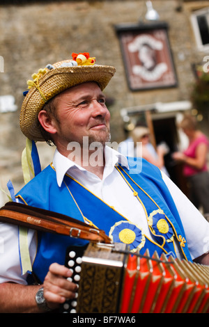 Morris Dancers outside the Victoria Inn, Eastleach, Gloucestershire, UK Stock Photo