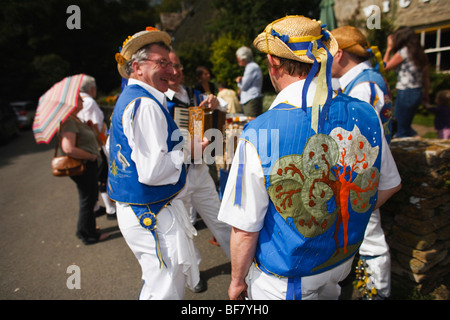 Morris Dancers outside the Victoria Inn, Eastleach, Gloucestershire, UK Stock Photo