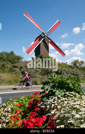 Windmill amongst sand dunes at De Panne. Stock Photo