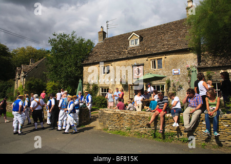 Morris Dancers outside the Victoria Inn, Eastleach, Gloucestershire, UK Stock Photo