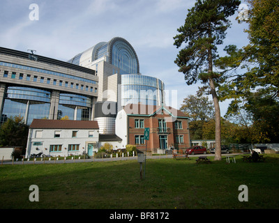 The rear side of the European Parliament building, Brussels, Belgium, where the EU totally overpowers existing buildings. Stock Photo