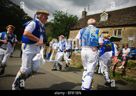 Morris Dancers outside the Victoria Inn, Eastleach, Gloucestershire, UK Stock Photo