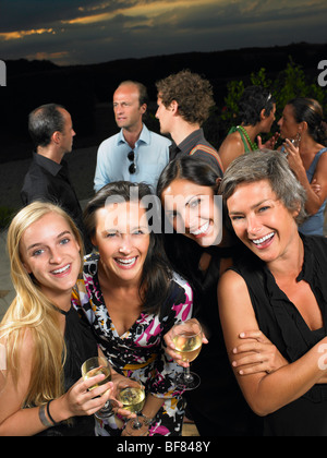 Girlfriends at a cocktail party Stock Photo