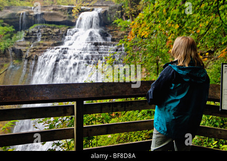 Woman Viewing Brandywine Falls in Cuyahoga Valley National Park in Ohio Stock Photo