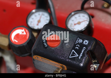 Air compressor gauge and controls Stock Photo