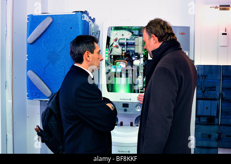 Paris, France, Construction Equipment Trade Show, Boiler, Be-Green Eco-House, Businessmen Talking about Heating, energy efficient home, ecological fra Stock Photo