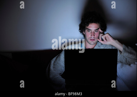 a young student using wifi laptop in the home Stock Photo