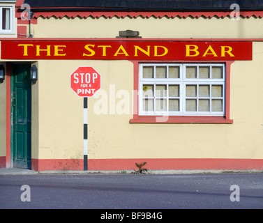 road sign painted on Traditional Irish pub in southwest Ireland Stock Photo