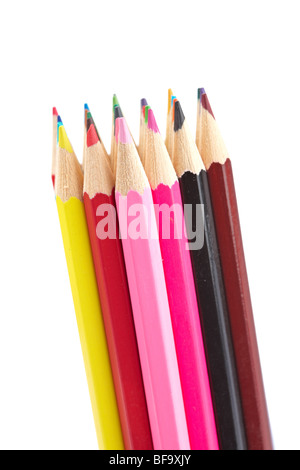 Assortment of coloured pencils isolated on white background. Shallow depth of field Stock Photo