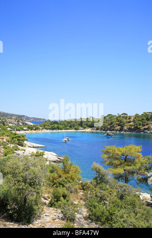 boats at an idyllic bay near Alyki on the island of Thasos, Macedonia, Greece Stock Photo
