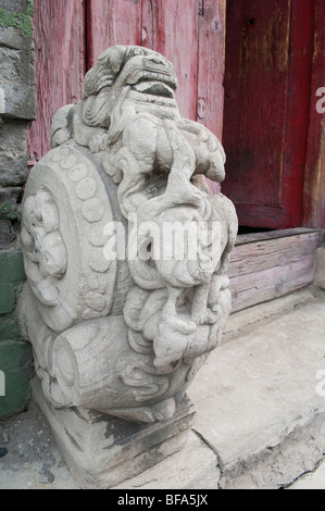 Close up of a carved stone at a doorway to a Beijing hutong. Stock Photo